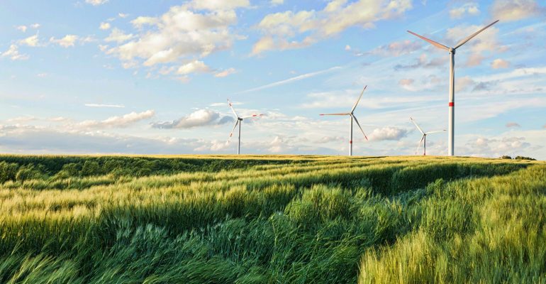 Beautiful shot of wind turbines under the cloudy sky in the Eiffel region, Germany