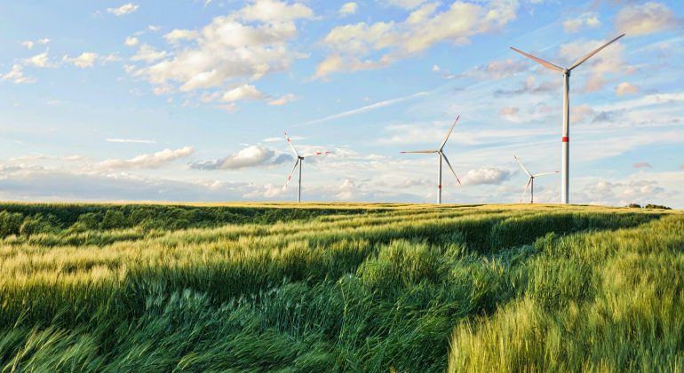 Beautiful shot of wind turbines under the cloudy sky in the Eiffel region, Germany